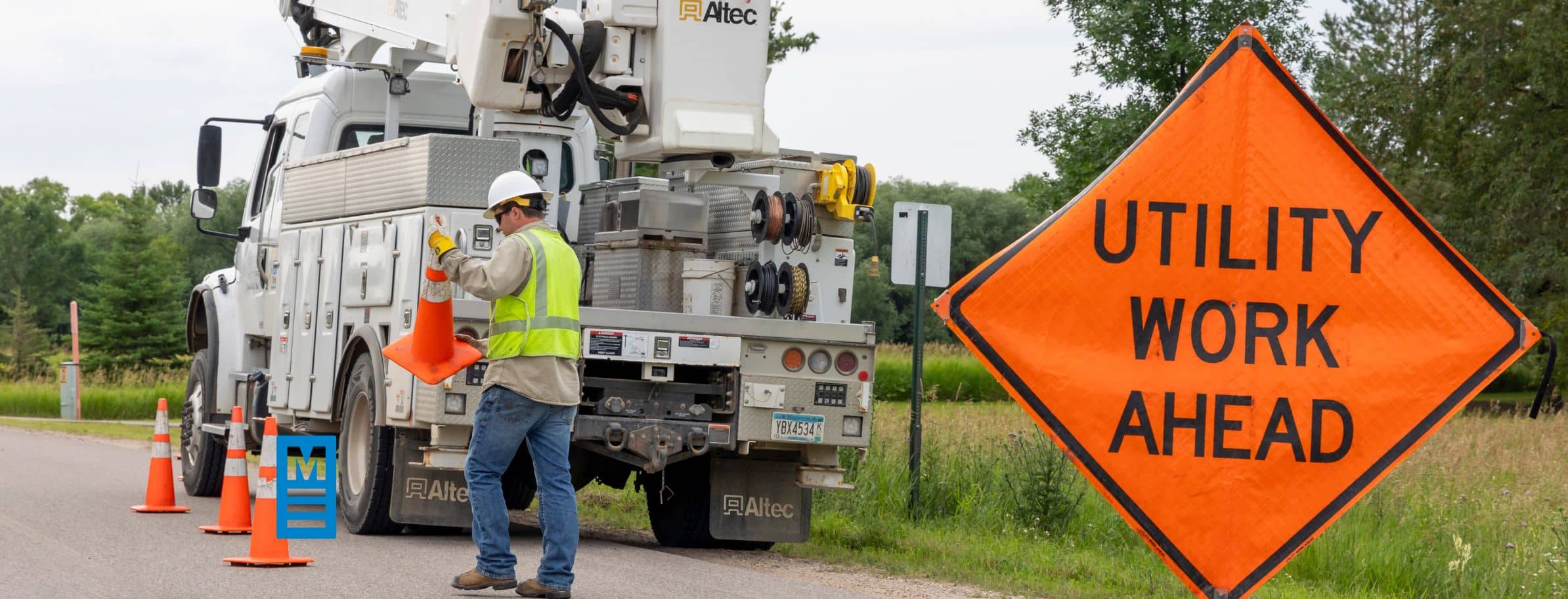 Placing utility sign and traffic cones