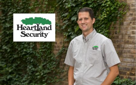 Heartland Security person standing in front of brick building