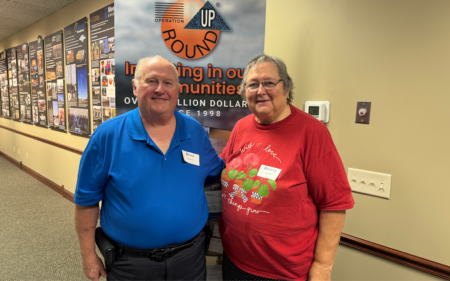 From Member to Informed Member-Owner 2 Members standing in lobby.